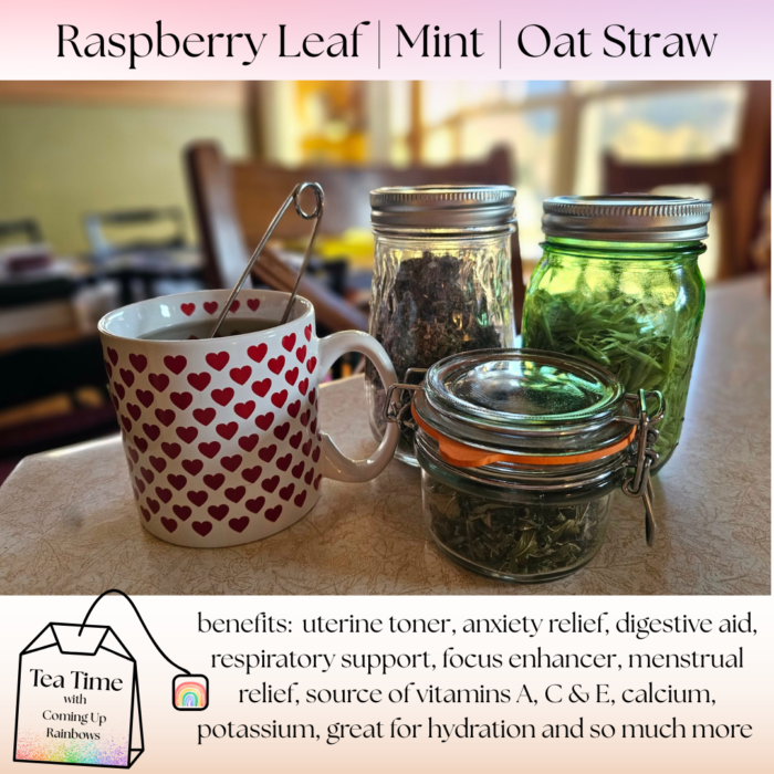 Raspberry leaf, mint and oat straw herbal tea in a heart mug with dried herbs in glass jars